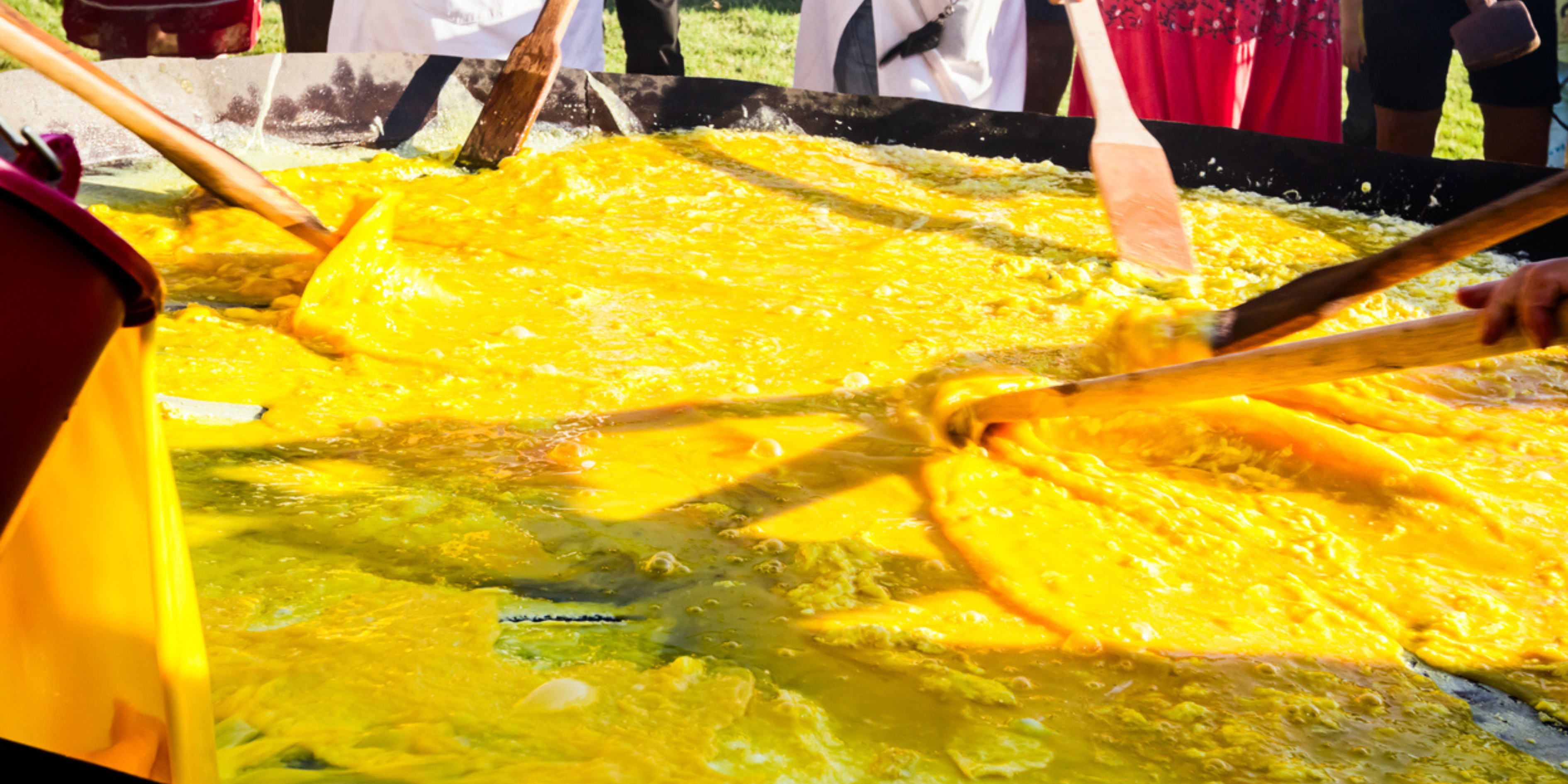 5 Easter Celebrations Around the Globe: Embracing Diversity and Tradition: this a photo of a giant omelette being cooked on a large frypan.